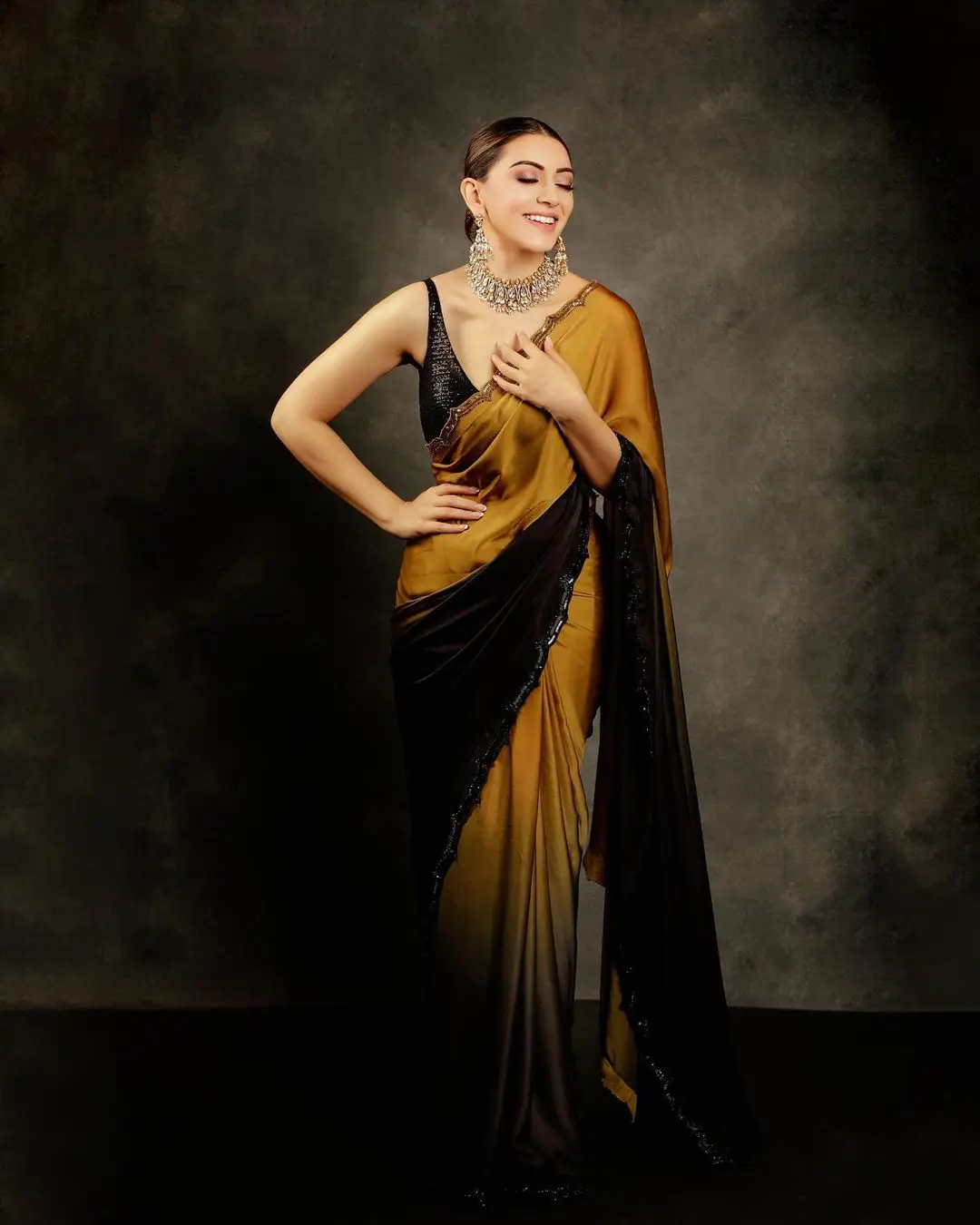 ACTRESS HANSIKA MOTWANI STILLS IN YELLOW SAREE SLEEVELESS BLACK BLOUSE 7